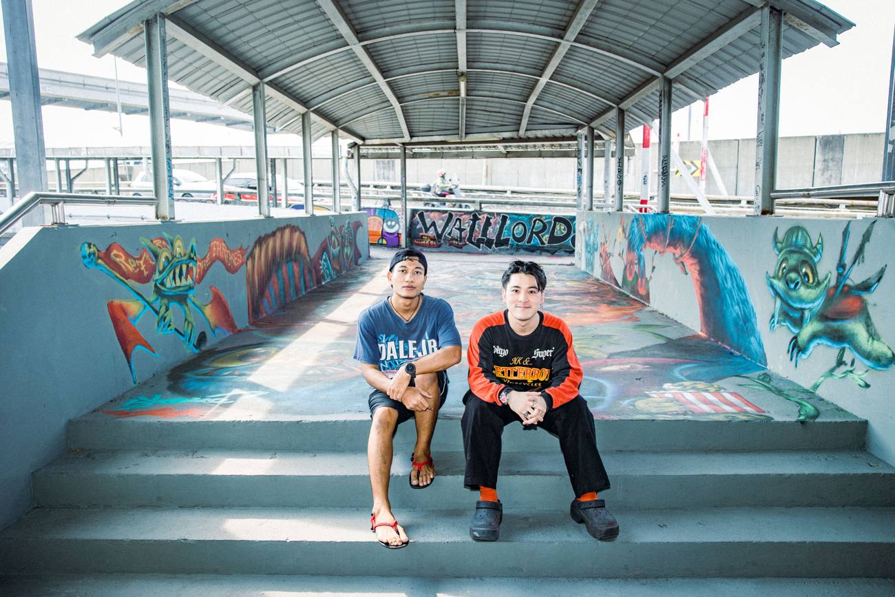 Artists in front of a mural wall, Bangkok